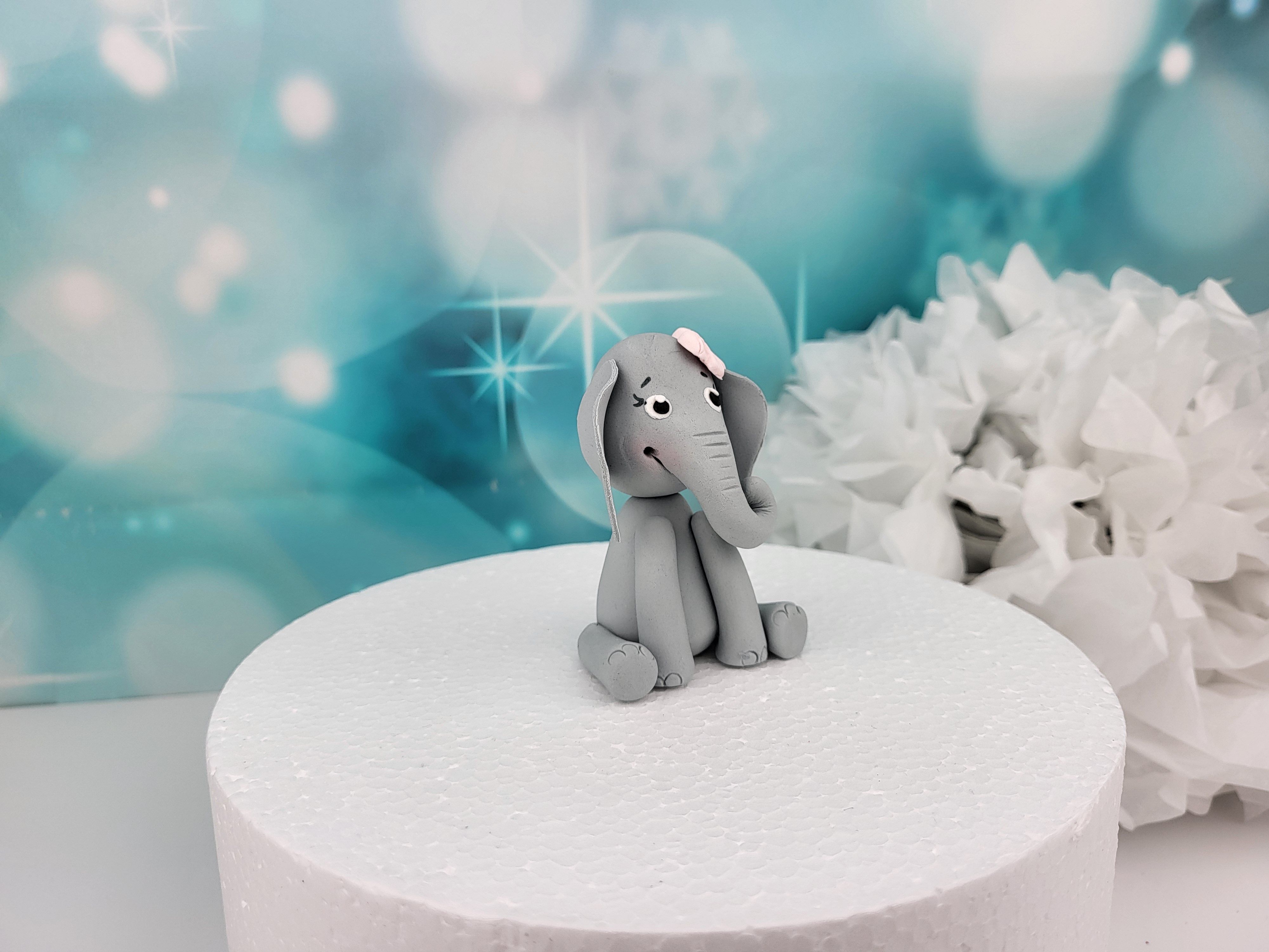 Tortenfigur Elefant mit rosa Schleife