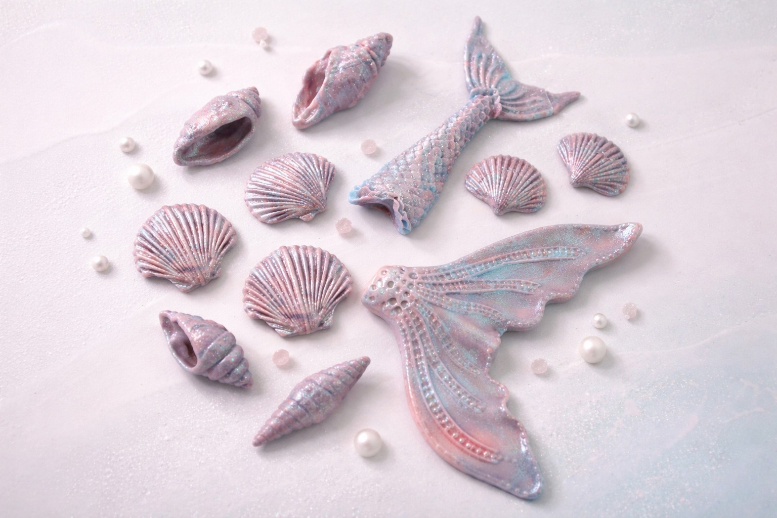 Zuckerdekoration Muscheln und Flosse
