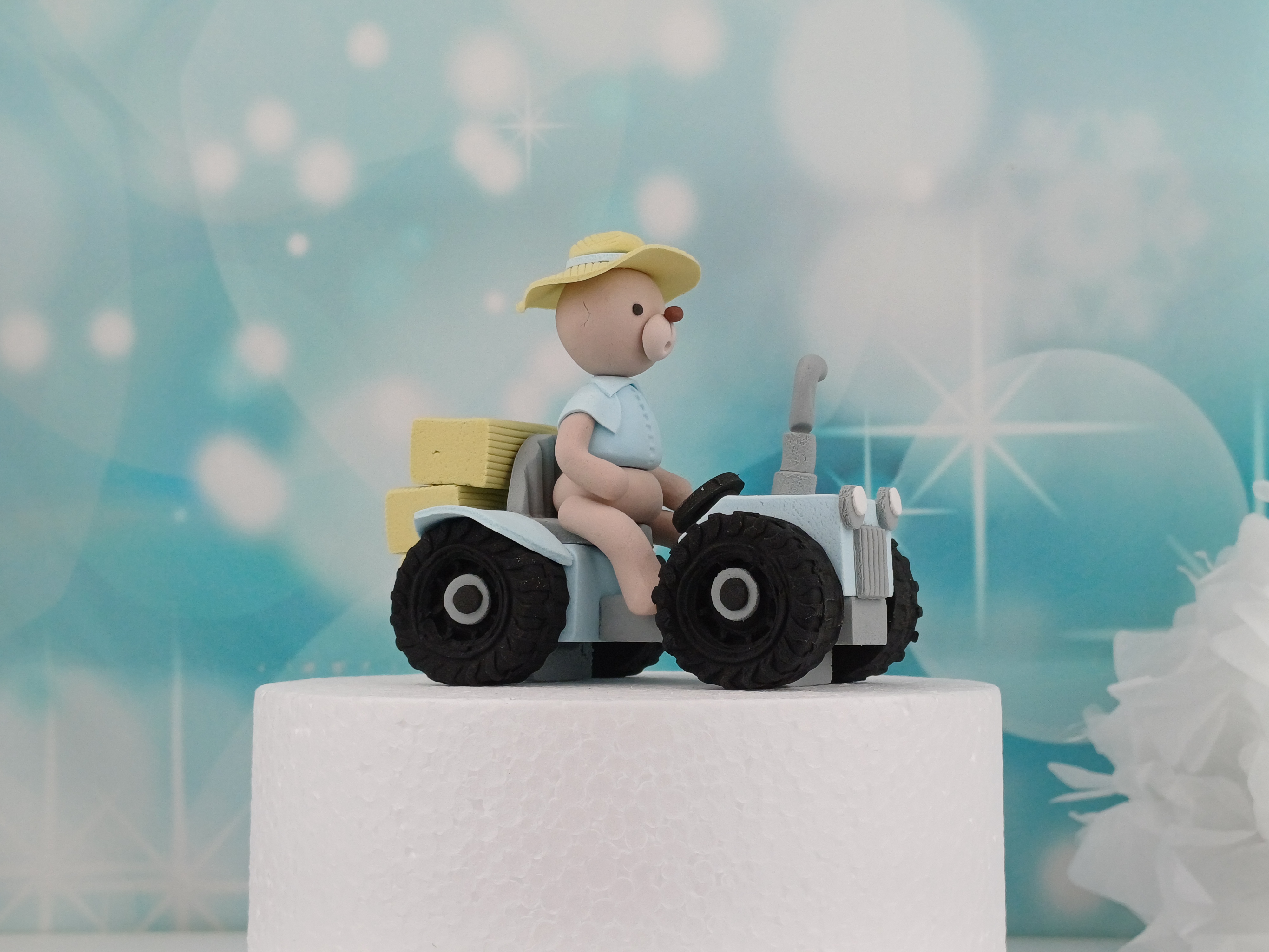 Tortenfigur Bär auf Traktor